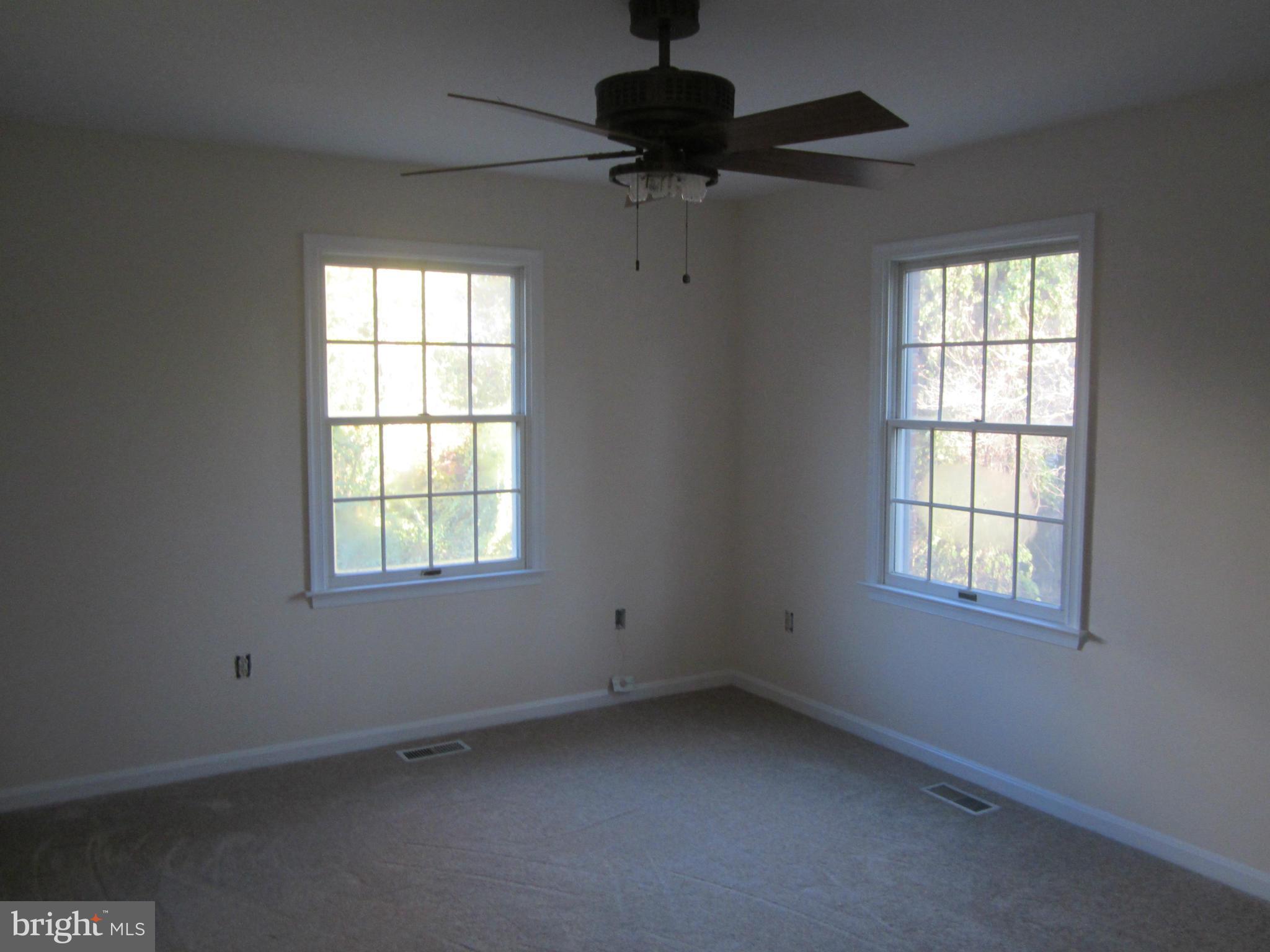 146 Calvert Towne Road Prince Frederick, MD 20678 - Photo 8 of 13 an empty room with a window