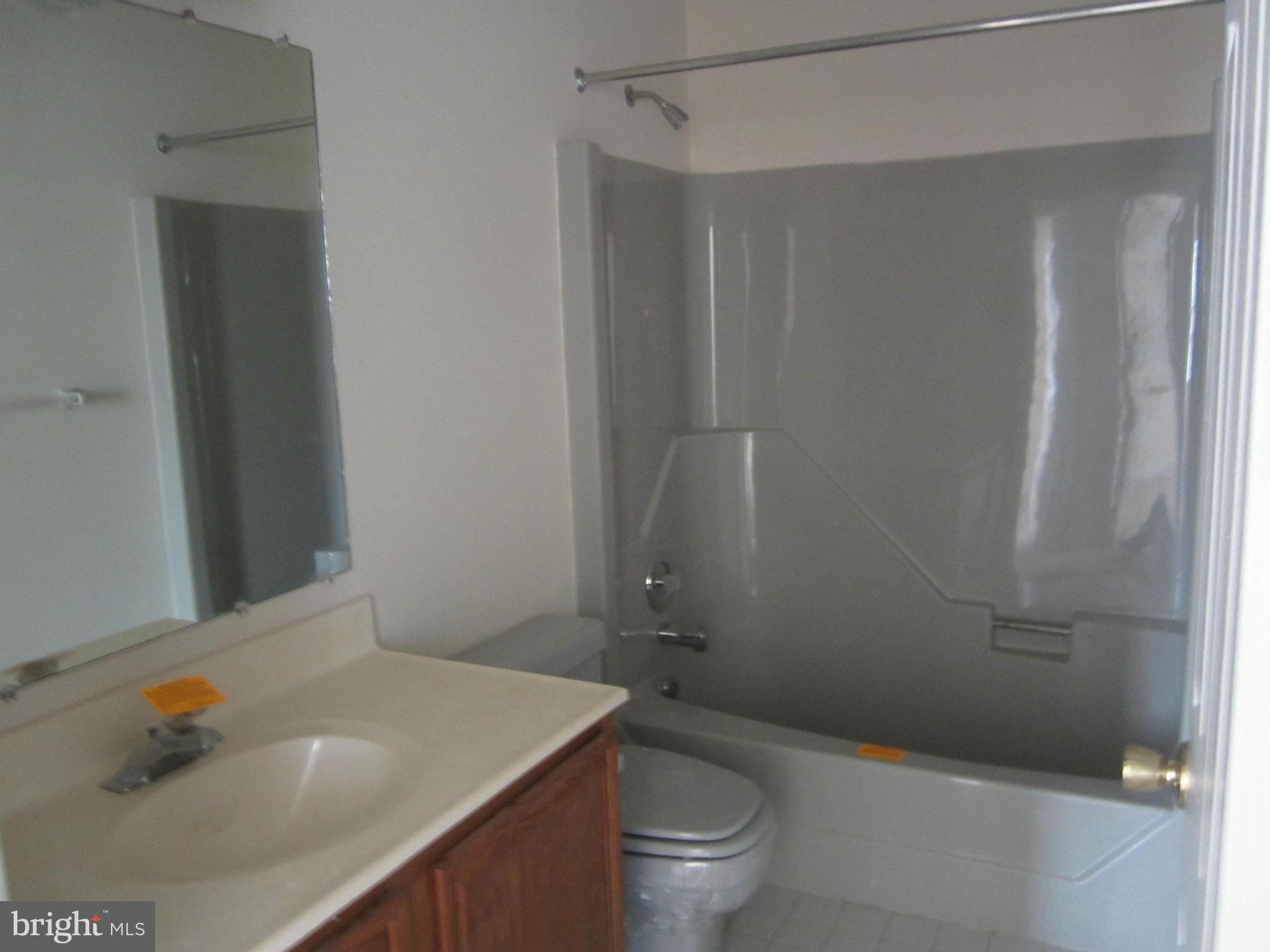 146 Calvert Towne Road Prince Frederick, MD 20678 - Photo 10 of 13 a bathroom with a sink and toilet