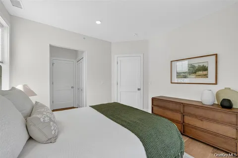 a bedroom with a bed and a desk