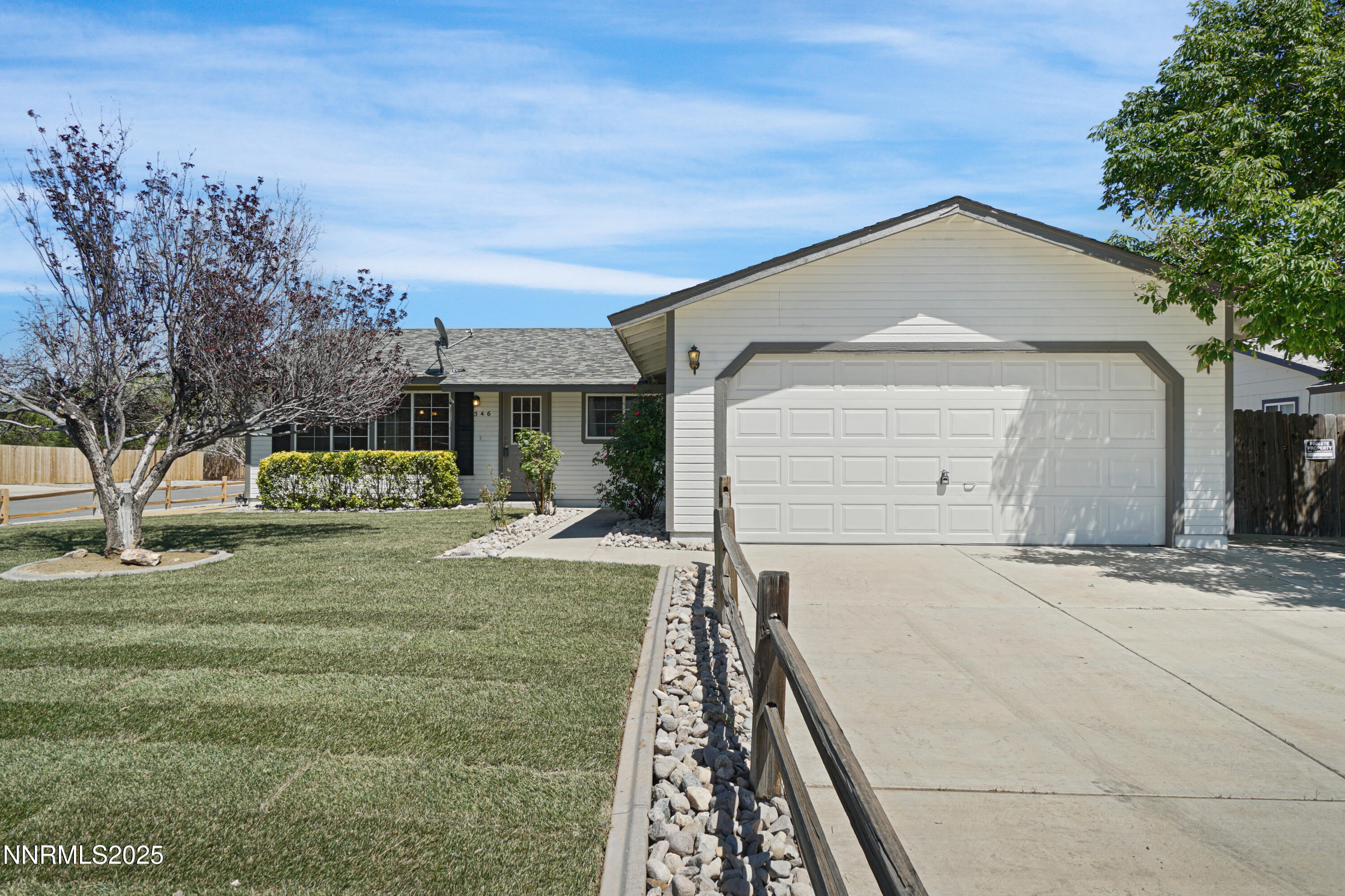 546 Yellow Jacket Road Dayton, NV 89403 - Photo 1 of 25 a front view of a house with garden