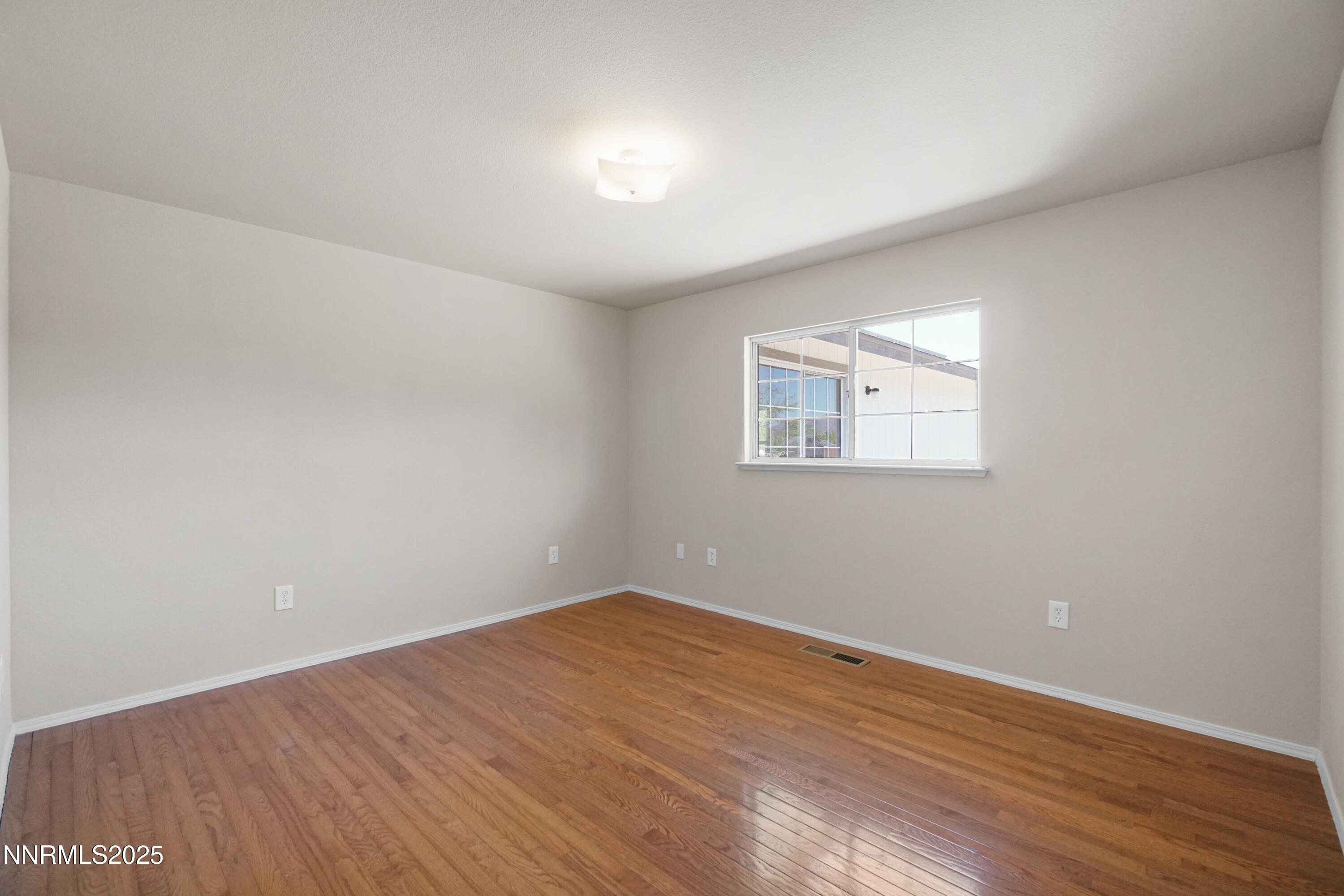 546 Yellow Jacket Road Dayton, NV 89403 - Photo 12 of 25 a view of a room with wooden floor and window