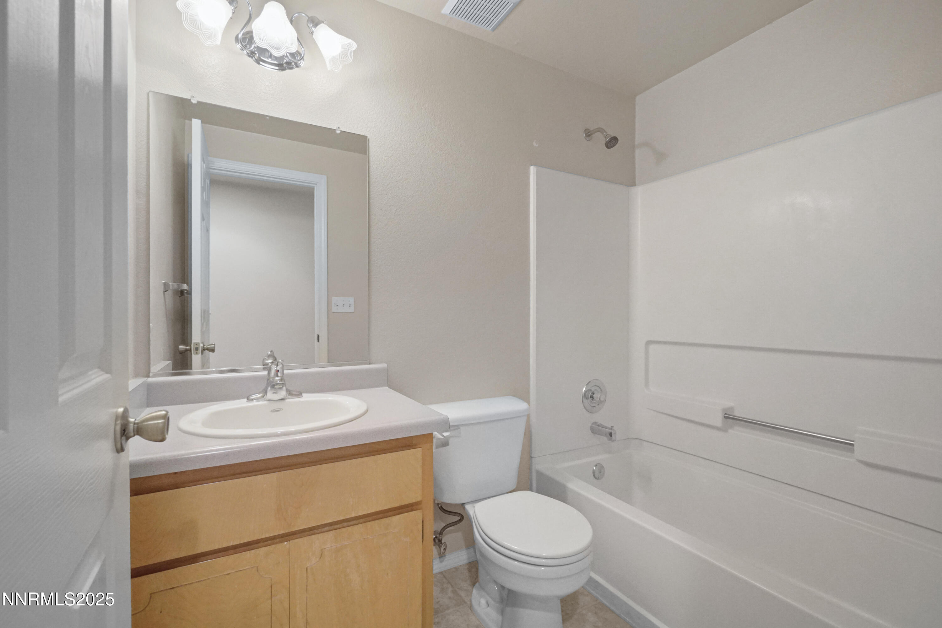 546 Yellow Jacket Road Dayton, NV 89403 - Photo 21 of 25 a bathroom with a sink toilet and shower