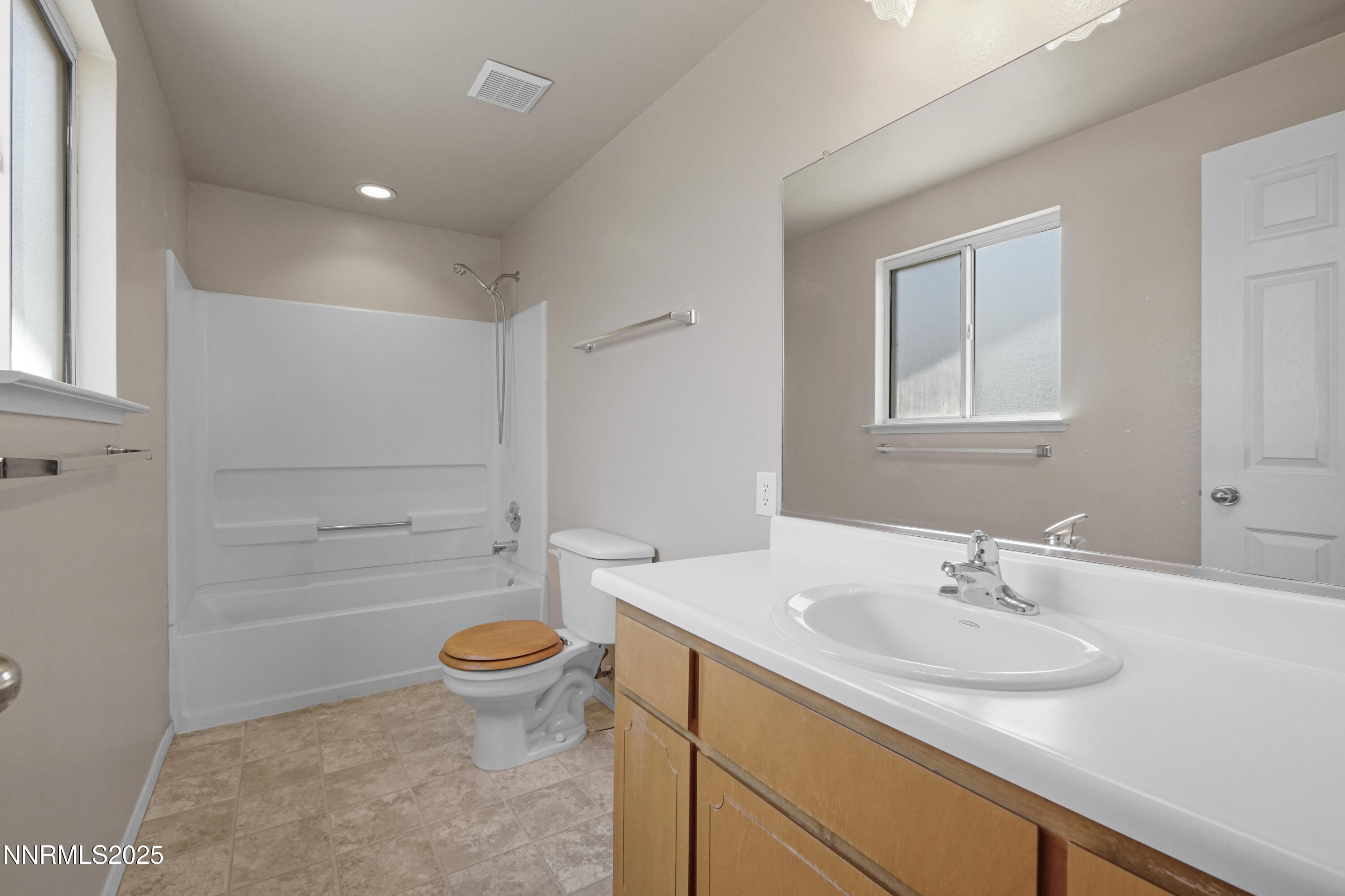 546 Yellow Jacket Road Dayton, NV 89403 - Photo 22 of 25 a bathroom with a sink a toilet and shower