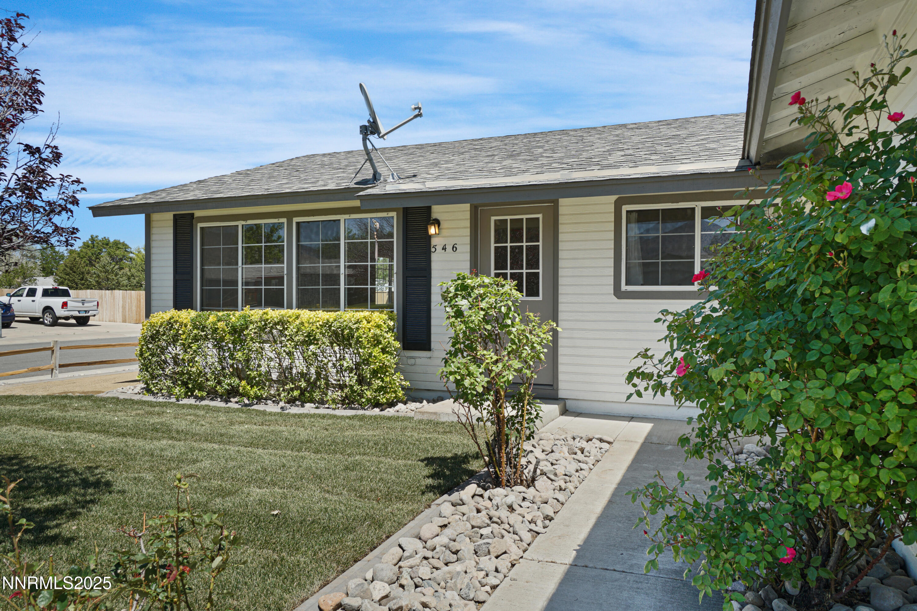 546 Yellow Jacket Road Dayton, NV 89403 - Photo 3 of 25 a front view of a house with garden