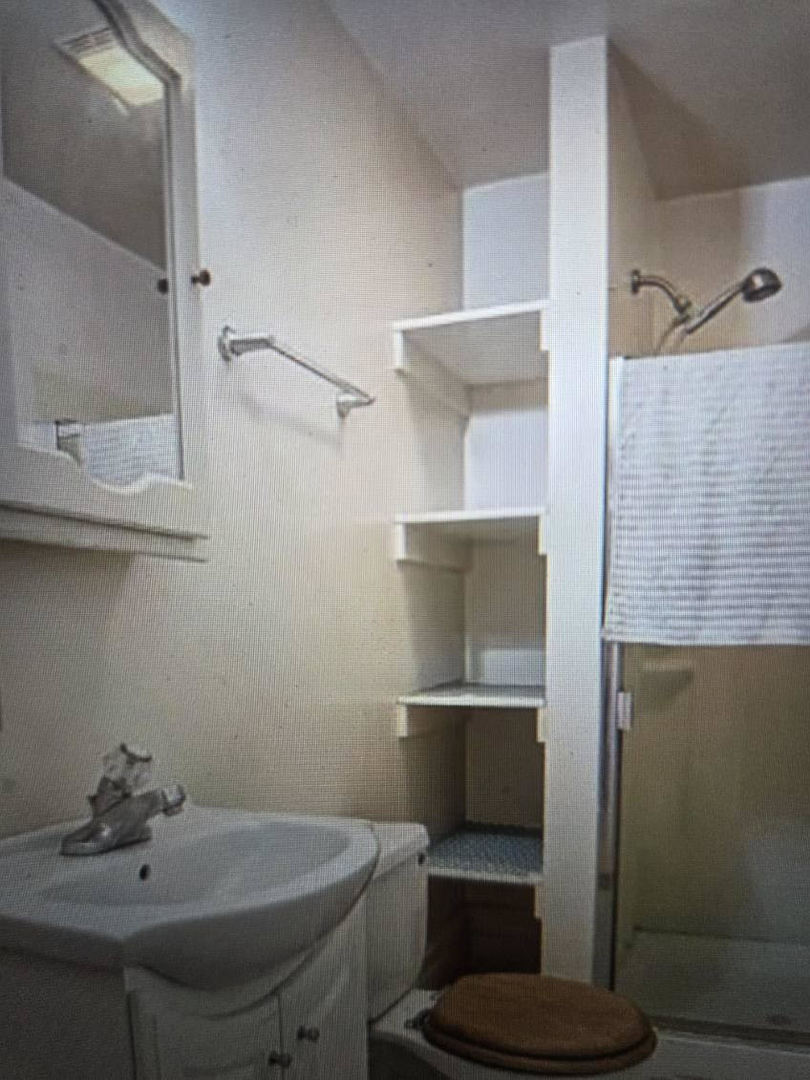 457 West William Street Decatur, IL 62522 - Photo 8 of 10 a bathroom with a sink and a toilet