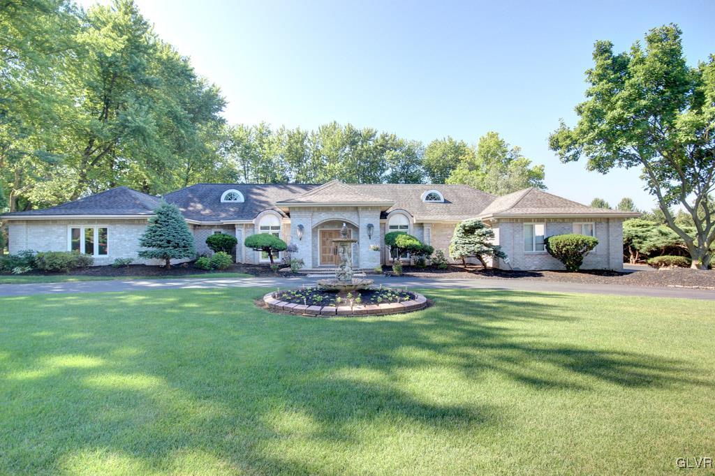 2270 Bishop Road Allentown, PA 18103 - Photo 1 of 33 a front view of a house with garden and trees