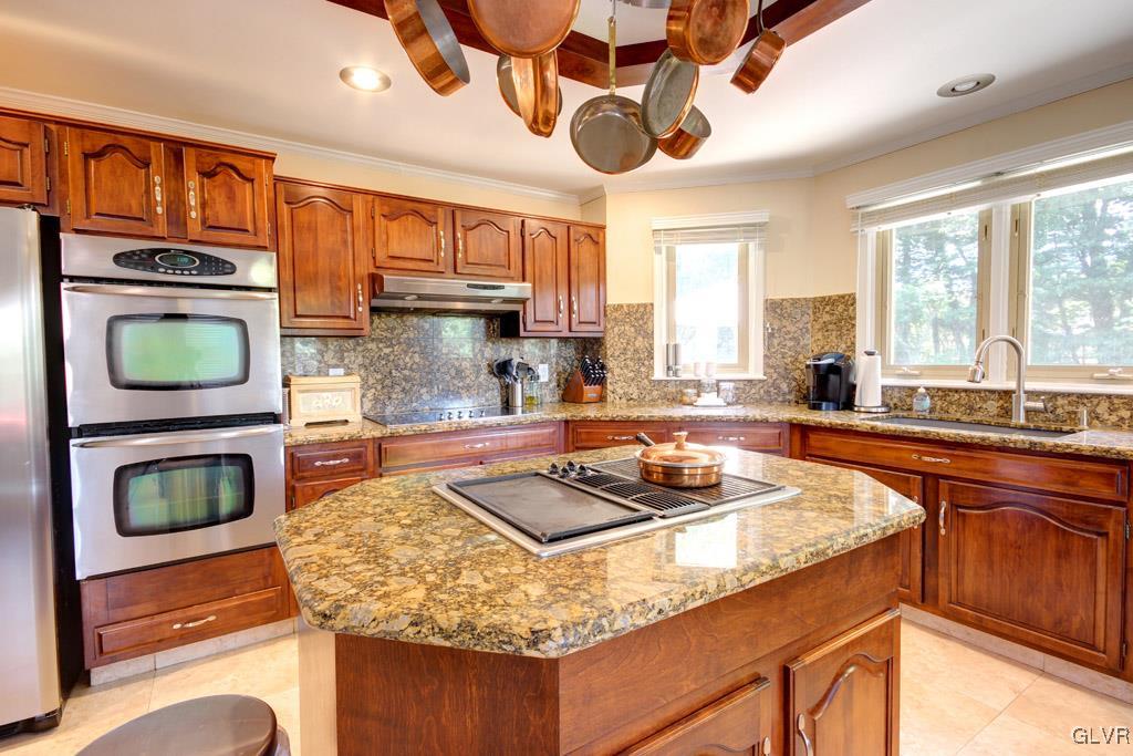 2270 Bishop Road Allentown, PA 18103 - Photo 11 of 33 a kitchen with a stove a sink and a microwave