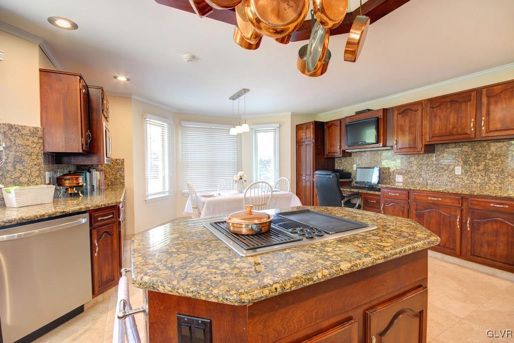 2270 Bishop Road Allentown, PA 18103 - Photo 12 of 33 a kitchen with kitchen island granite countertop a sink stove and cabinets