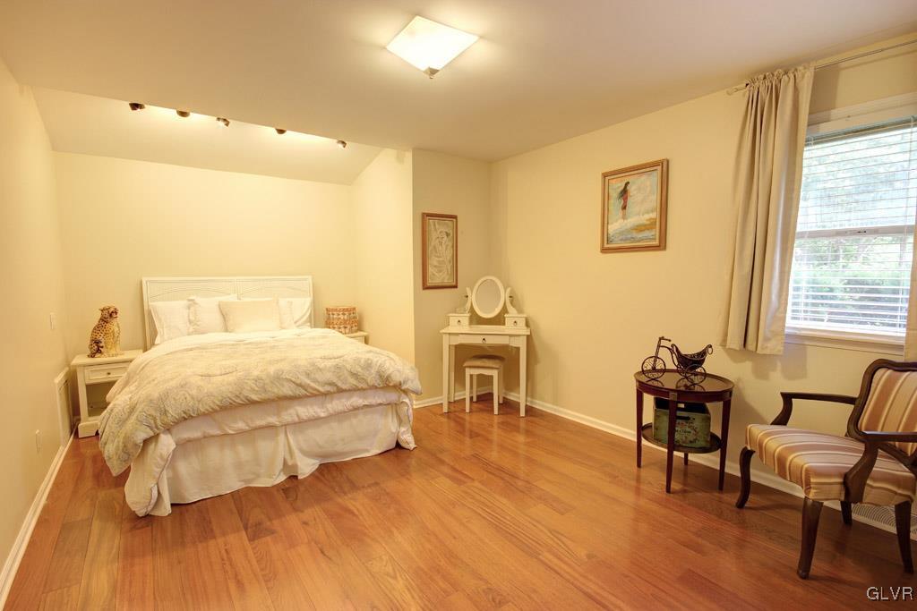 2270 Bishop Road Allentown, PA 18103 - Photo 20 of 33 a bedroom with a bed and wooden floor