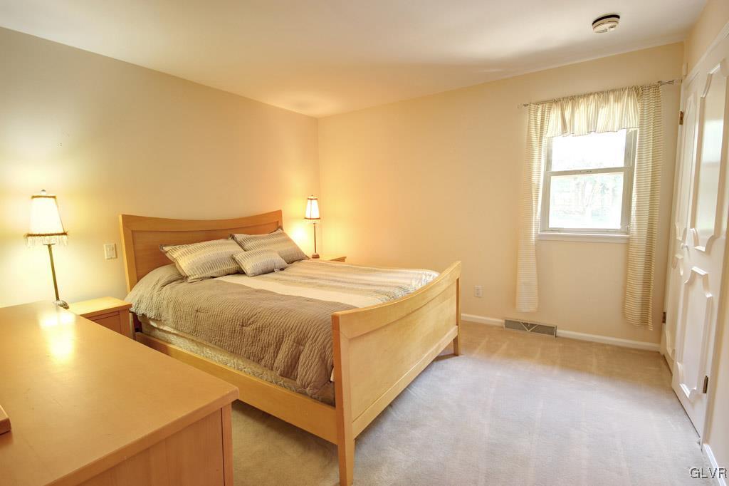 2270 Bishop Road Allentown, PA 18103 - Photo 21 of 33 a spacious bedroom with a bed and a window
