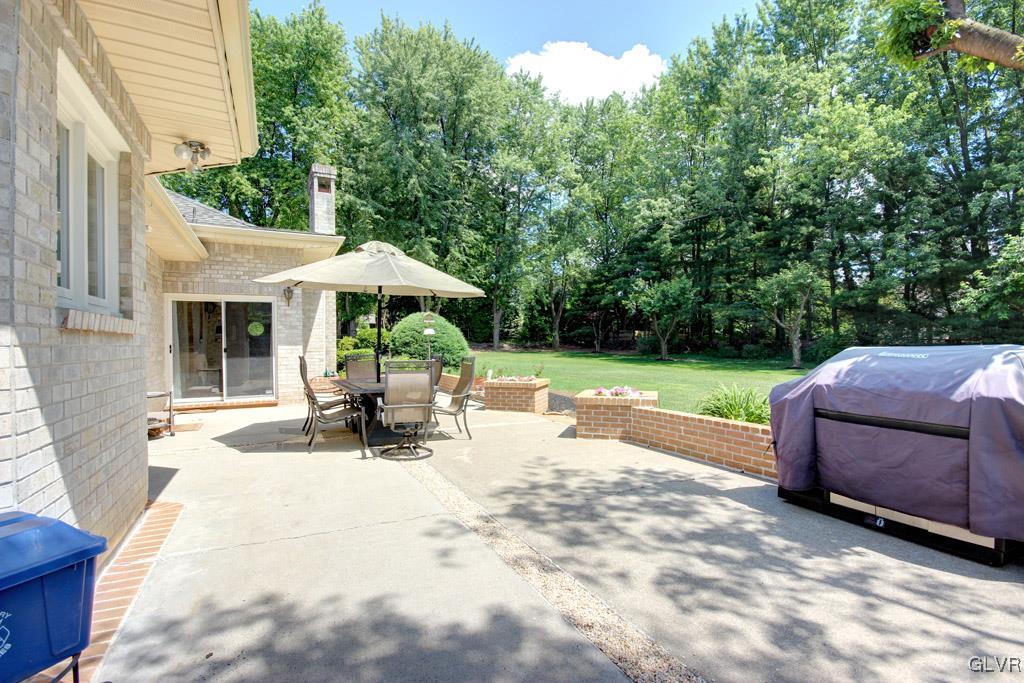 2270 Bishop Road Allentown, PA 18103 - Photo 31 of 33 a view of a patio with a table chairs and a yard