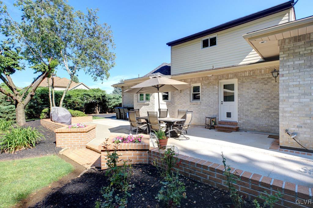 2270 Bishop Road Allentown, PA 18103 - Photo 32 of 33 a view of a patio with couches table and chairs under an umbrella