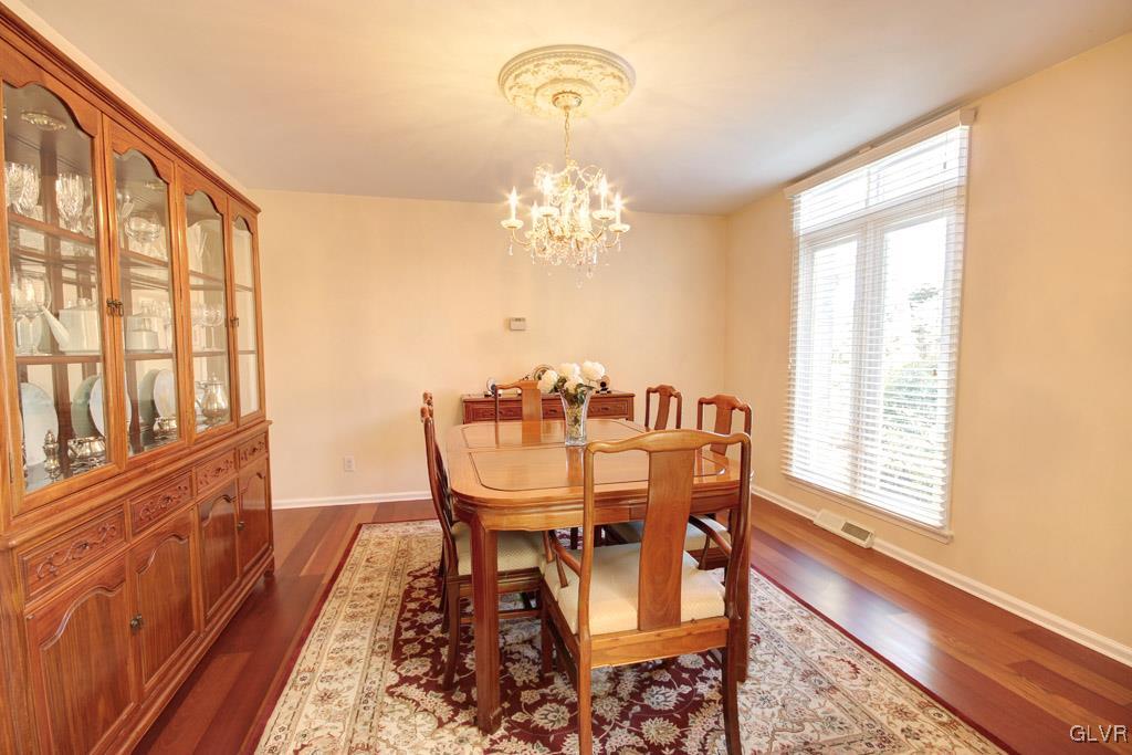 2270 Bishop Road Allentown, PA 18103 - Photo 5 of 33 a view of a dining room with furniture a chandelier and wooden floor