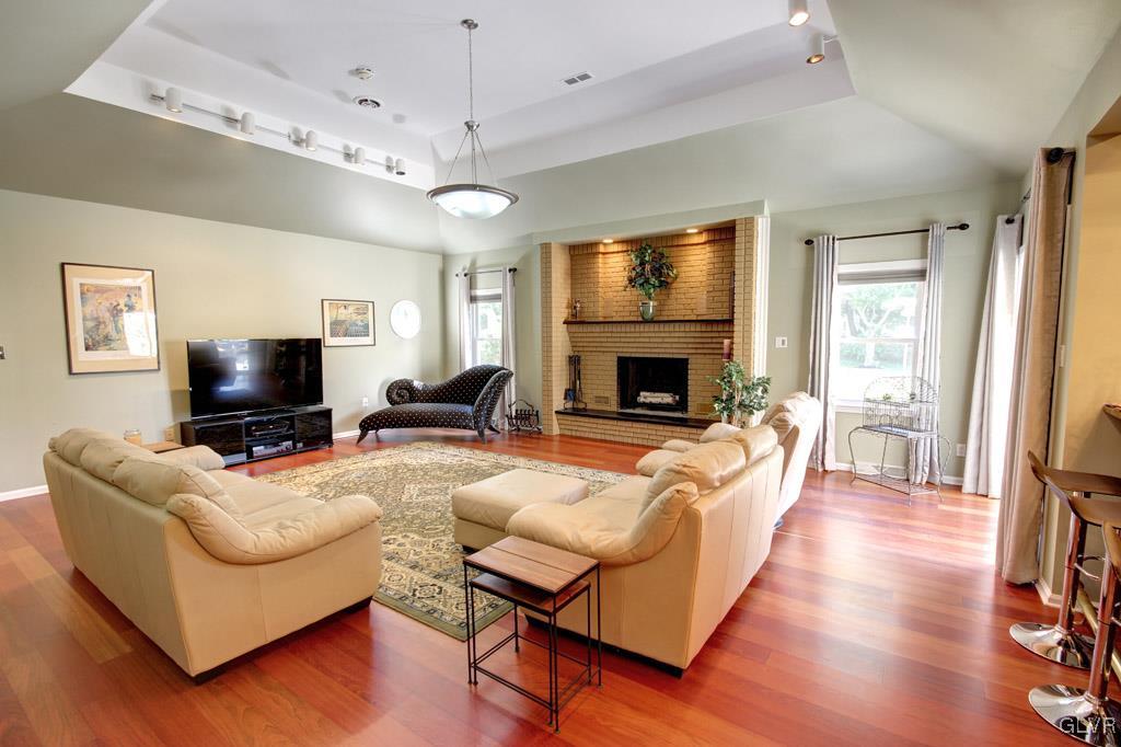 2270 Bishop Road Allentown, PA 18103 - Photo 8 of 33 a living room with furniture a flat screen tv and a fireplace