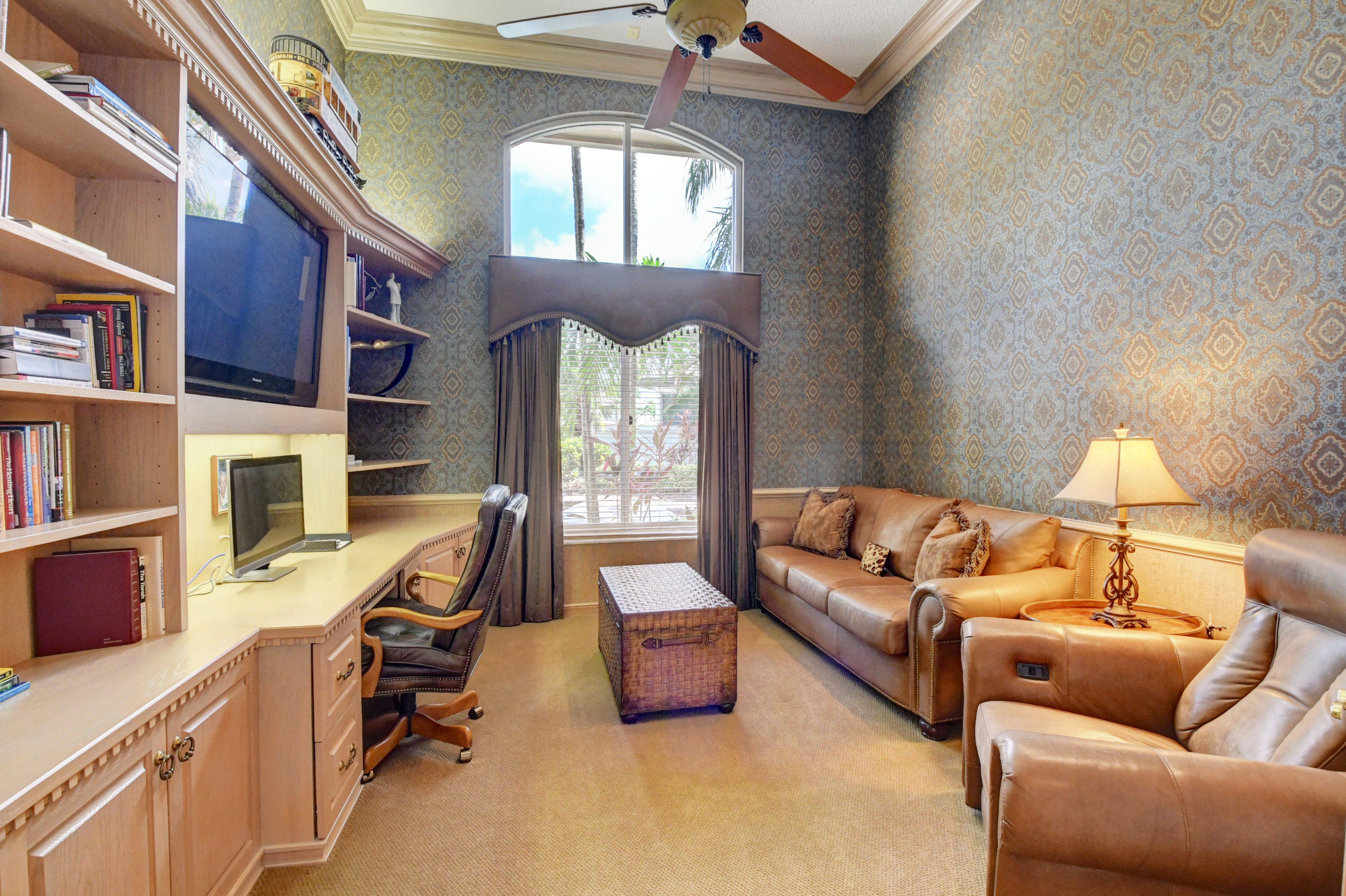 3196 Northwest 60th Street Boca Raton, FL 33496 - Photo 31 of 65 a living room with furniture fireplace and a window