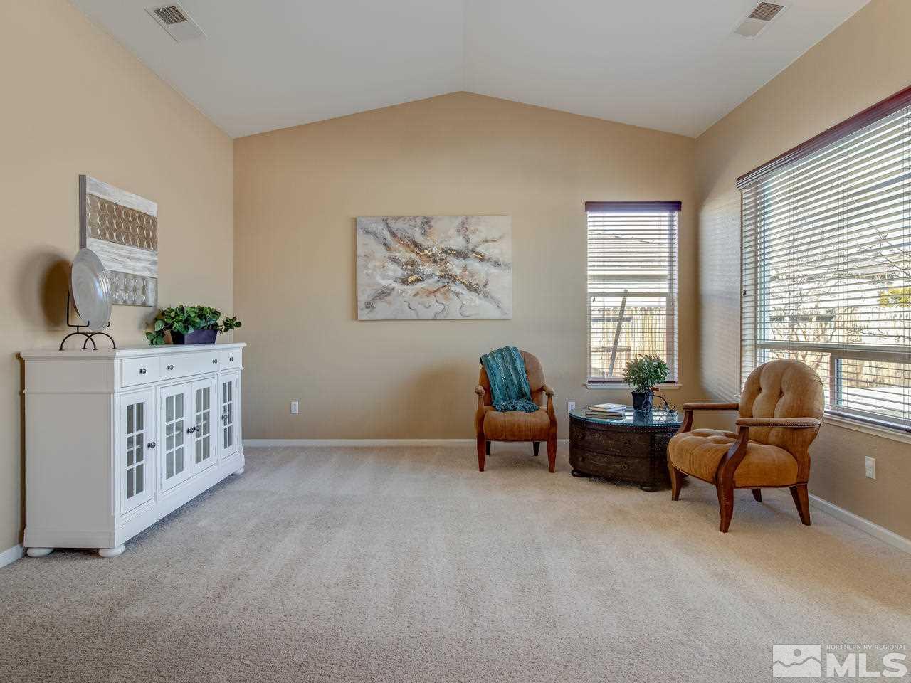 10520 Kenai Drive Reno, NV 89521 - Photo 4 of 25 a bedroom with furniture and a window