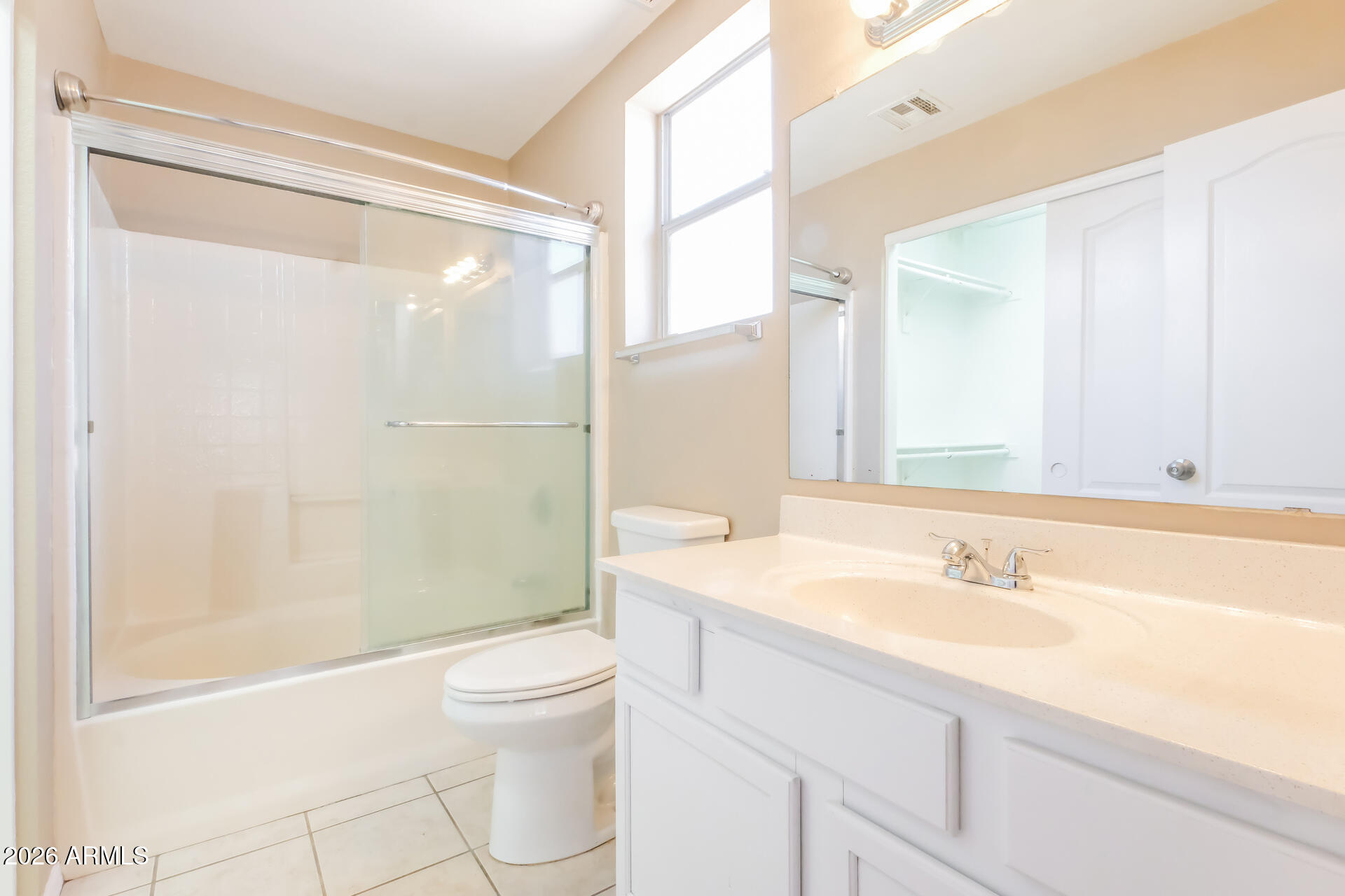 1108 West 13th Avenue Apache Junction, AZ 85120 - Photo 10 of 21 a bathroom with a sink a toilet and a large mirror
