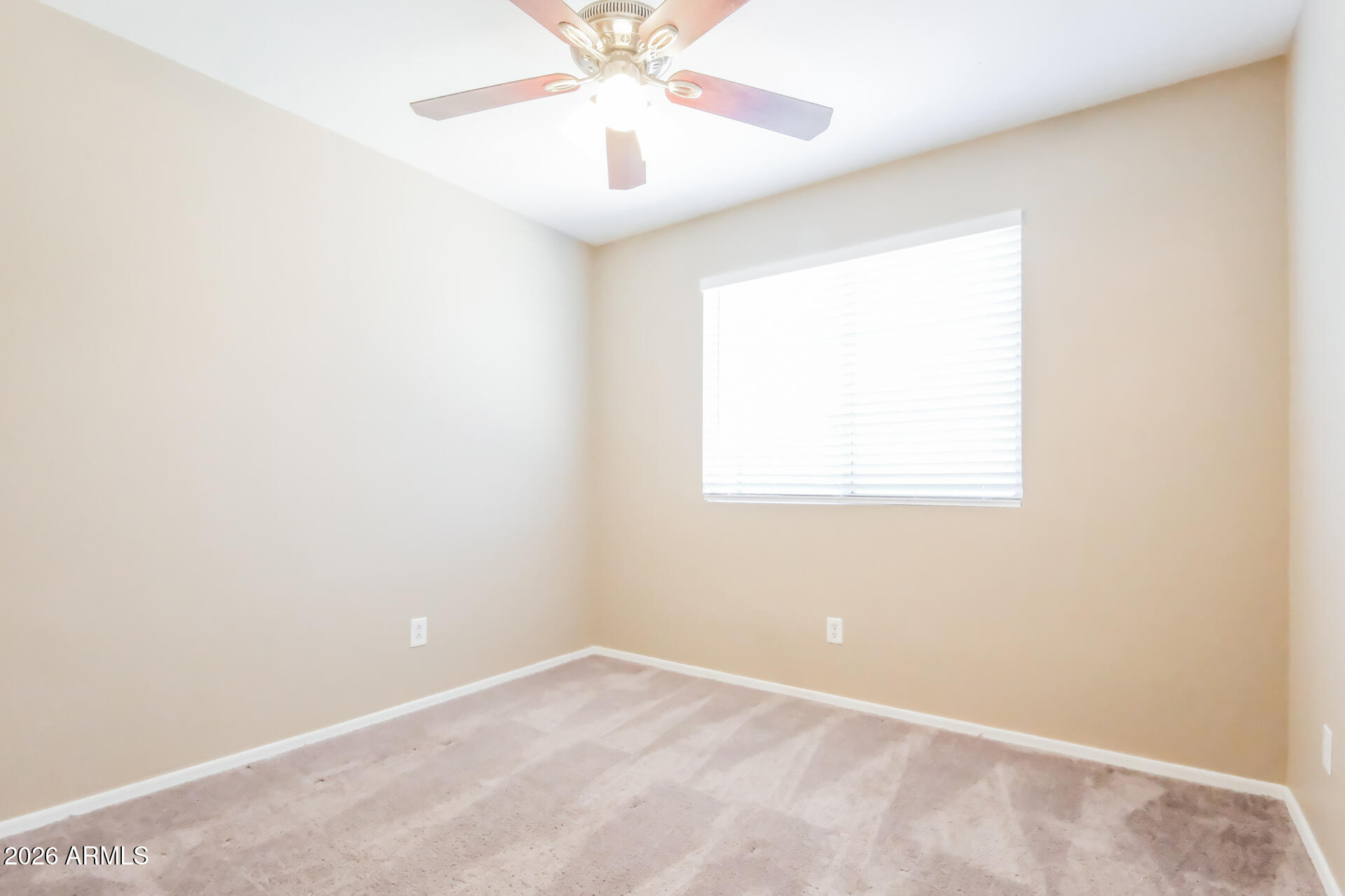 1108 West 13th Avenue Apache Junction, AZ 85120 - Photo 12 of 21 an empty room with a window