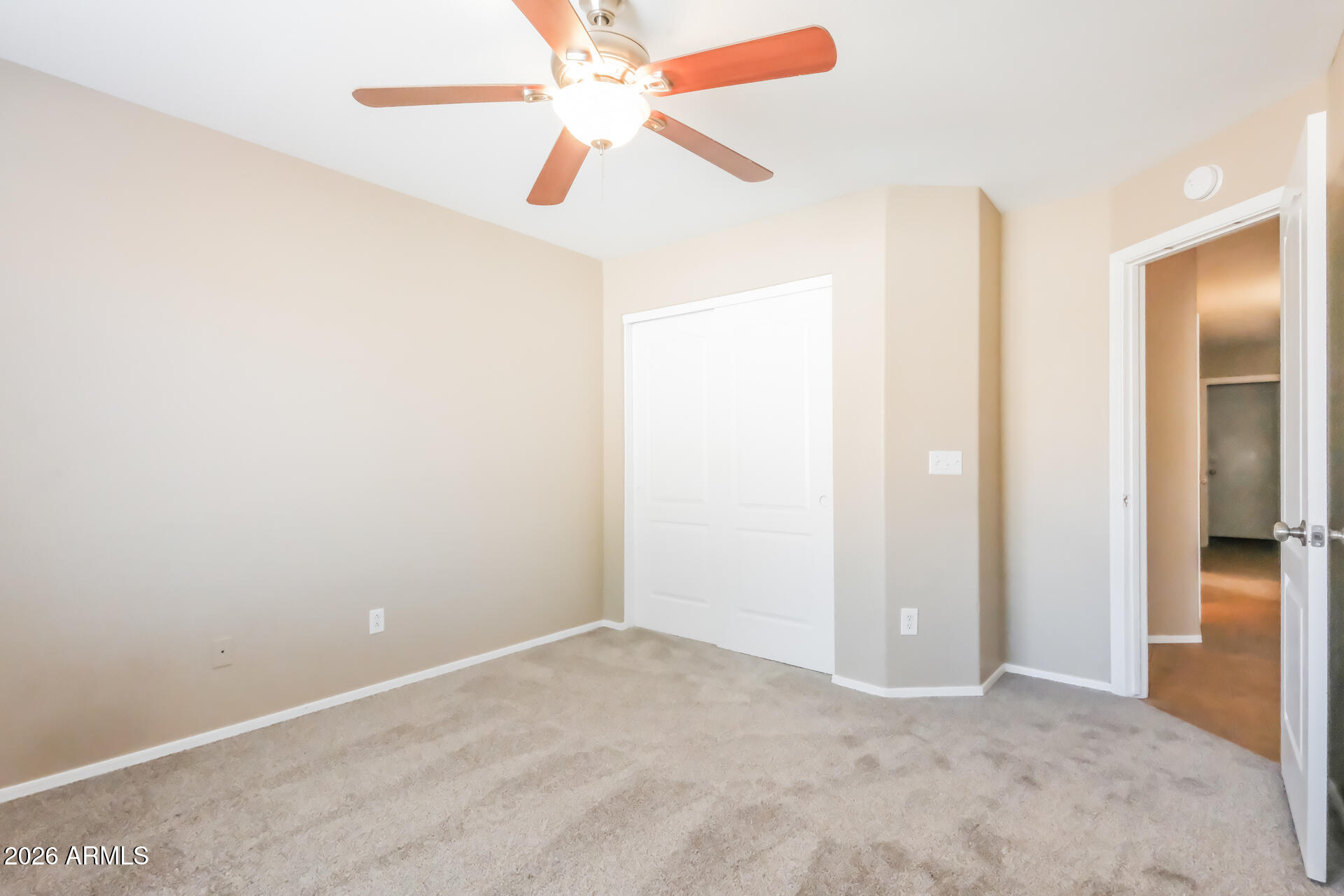 1108 West 13th Avenue Apache Junction, AZ 85120 - Photo 16 of 21 an empty room with closet and a chandelier fan