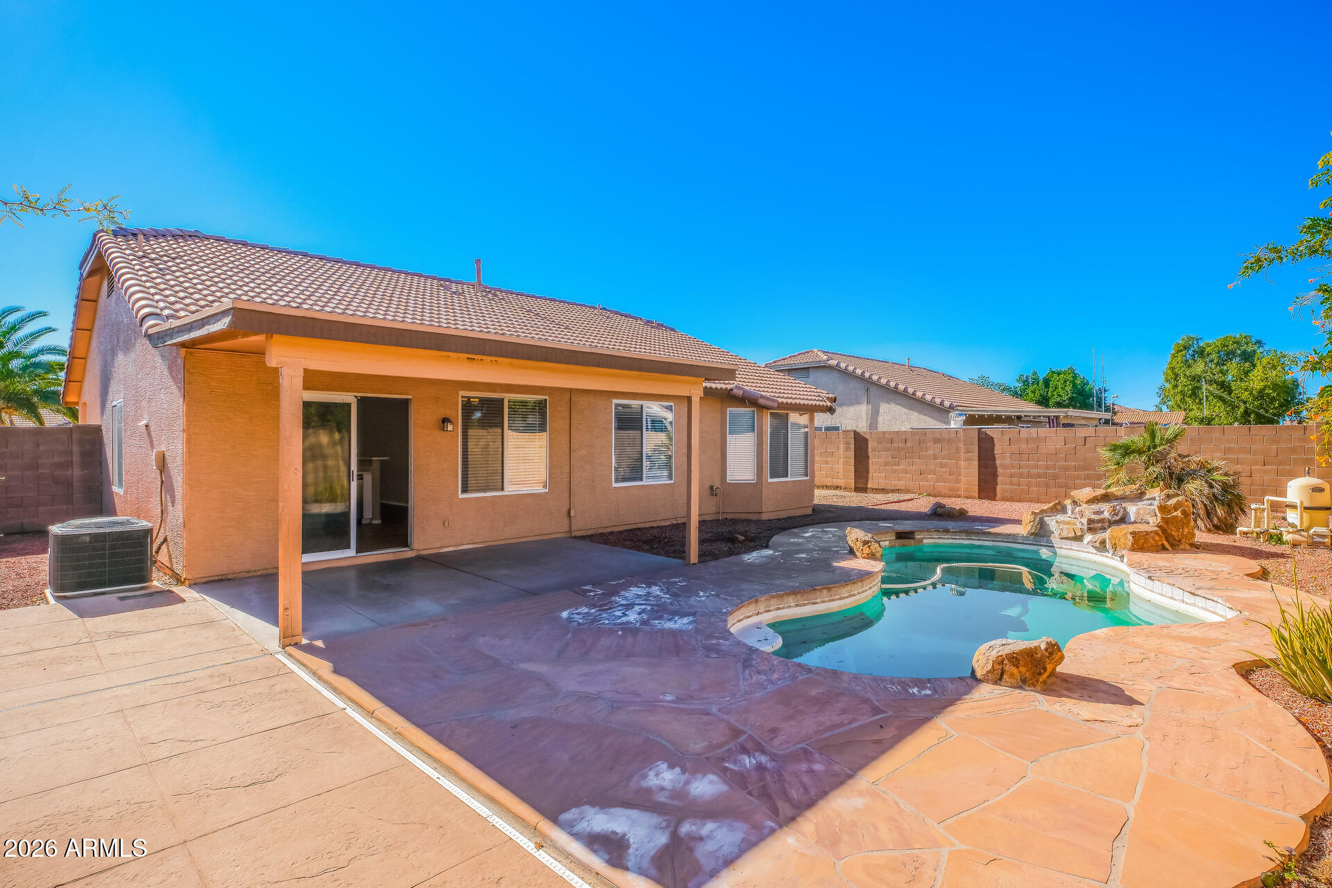 1108 West 13th Avenue Apache Junction, AZ 85120 - Photo 20 of 21 a front view of a house with garden