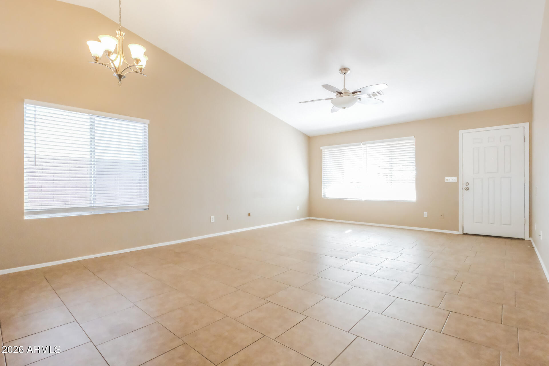 1108 West 13th Avenue Apache Junction, AZ 85120 - Photo 3 of 21 a view of an empty room with a window