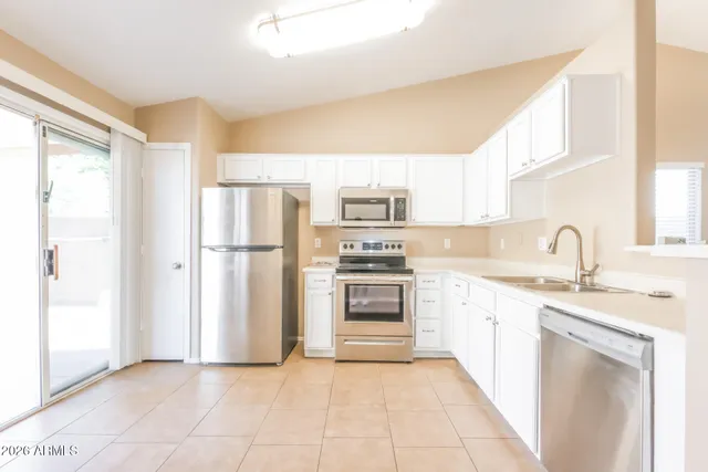 a view of a kitchen with a stove cabinets and a kitchen