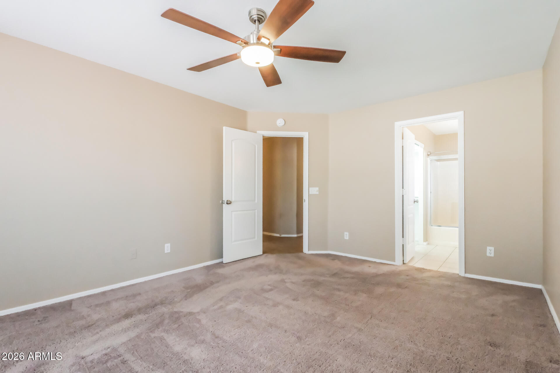 1108 West 13th Avenue Apache Junction, AZ 85120 - Photo 9 of 21 an empty room with closet and a chandelier fan