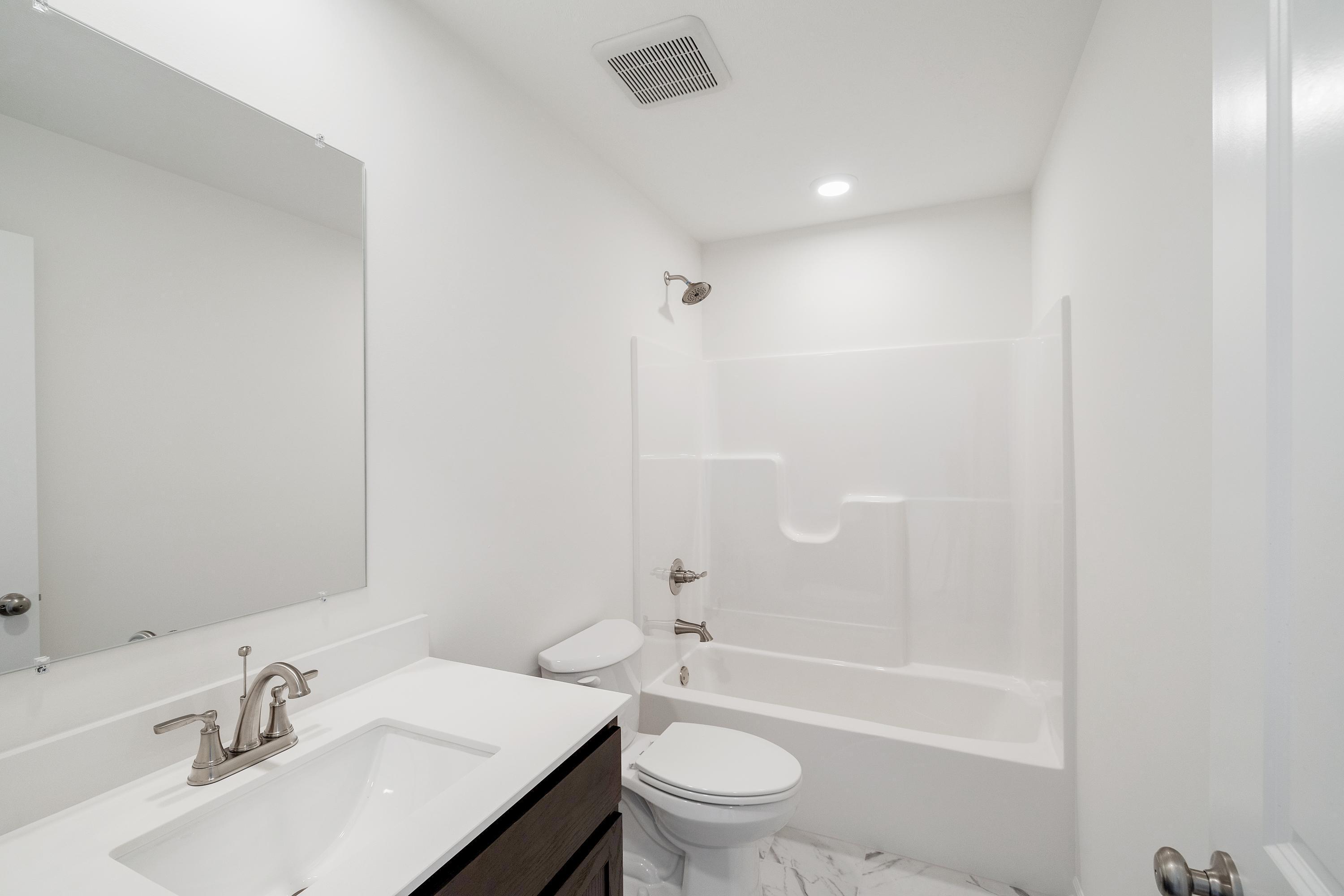 3758 Wild Grove Way Valparaiso, IN 46385 - Photo 16 of 19 a bathroom with a sink toilet and shower