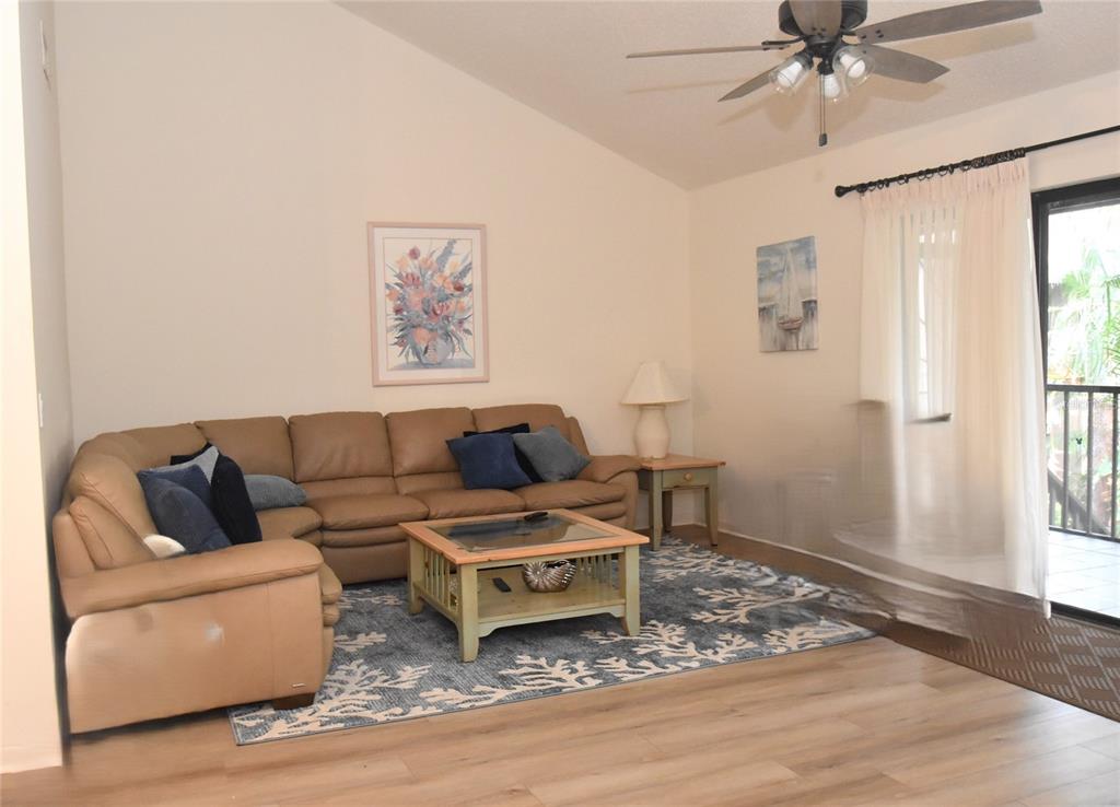 1712 Glenhouse Drive, Unit GL418 Sarasota, FL 34231 - Photo 25 of 37 a living room with furniture and a window