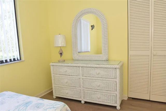 a view of a room with a flat screen tv and a floor to ceiling window