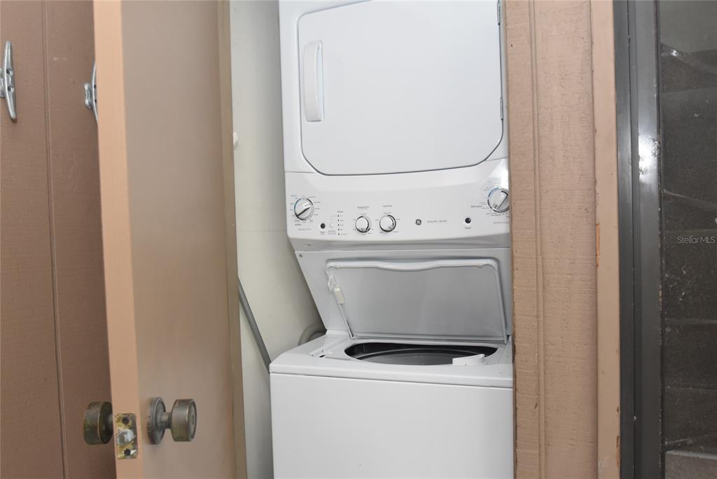 1712 Glenhouse Drive, Unit GL418 Sarasota, FL 34231 - Photo 37 of 37 a utility room with dryer and washer