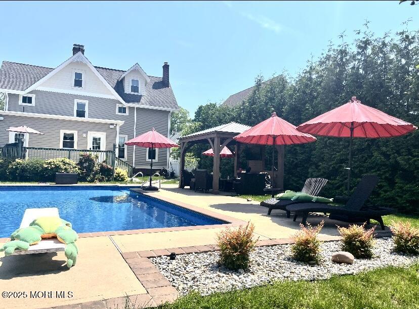 75 Elizabeth Street Keyport, NJ 07735 - Photo 43 of 61 a view of a house with swimming pool and sitting area