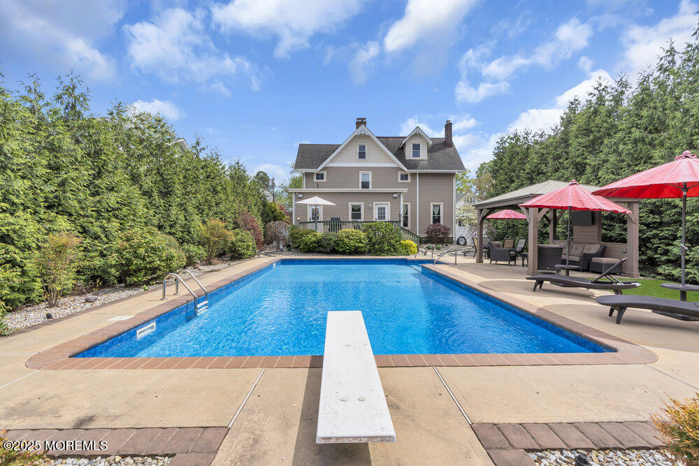 75 Elizabeth Street Keyport, NJ 07735 - Photo 44 of 61 a view of swimming pool with a lounge chairs