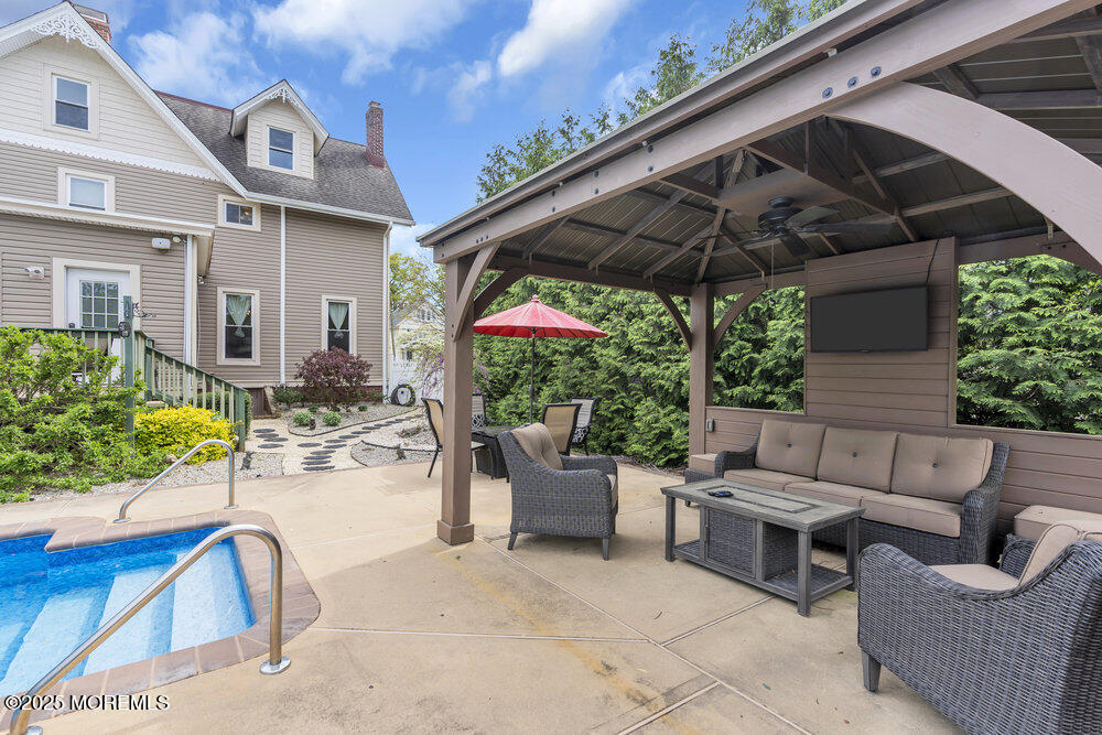 75 Elizabeth Street Keyport, NJ 07735 - Photo 48 of 61 a view of a patio with couches and potted plants
