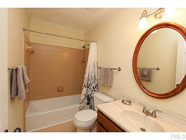 2700 Mattlyn Court Raleigh, NC 27613 - Photo 21 of 25 Second floor bath with tile surround and ceramic tile floor. Bathroom