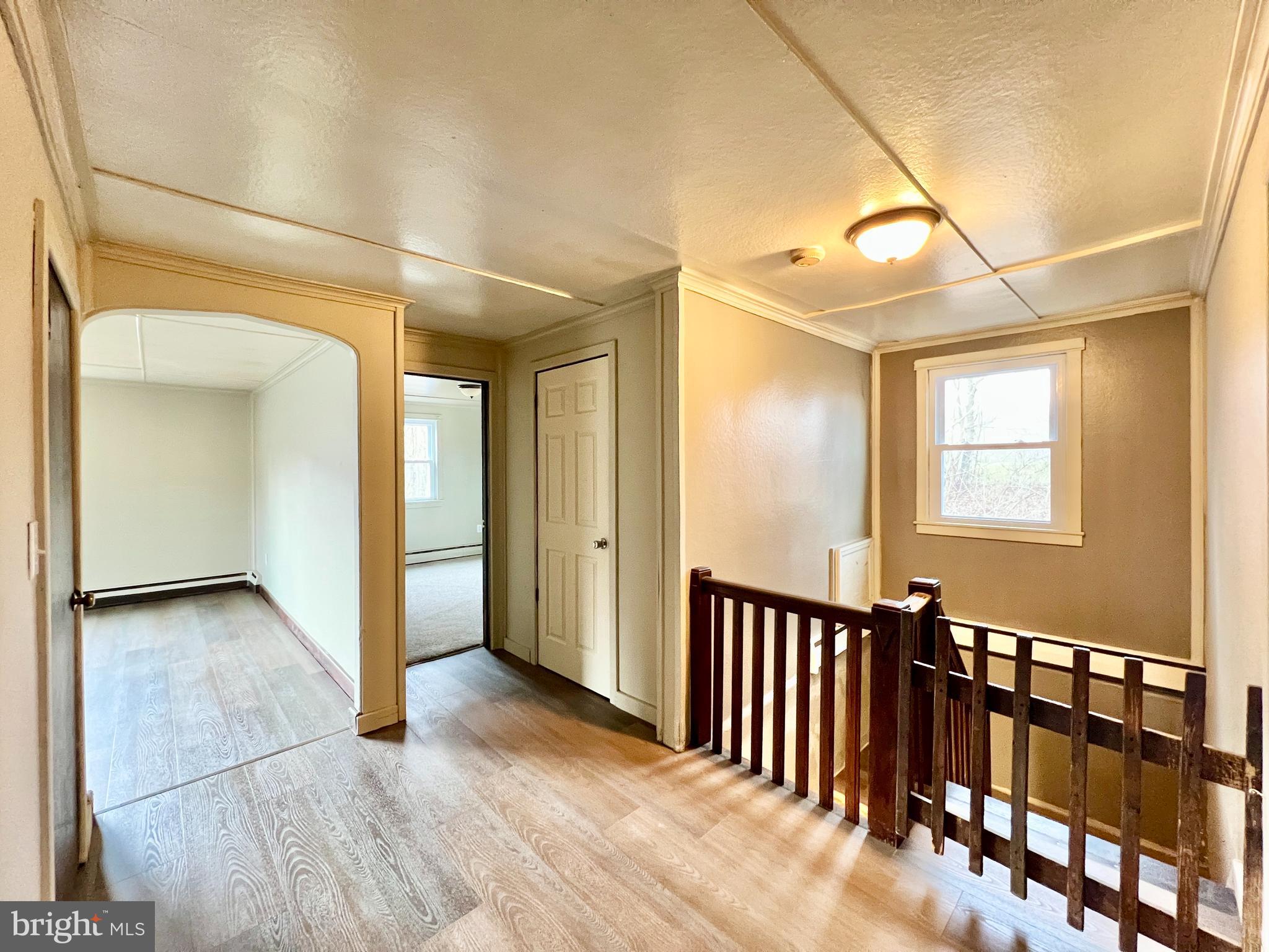 1722 Saxton Road Saxton, PA 16678 - Photo 13 of 24 a view of a hallway with wooden floor