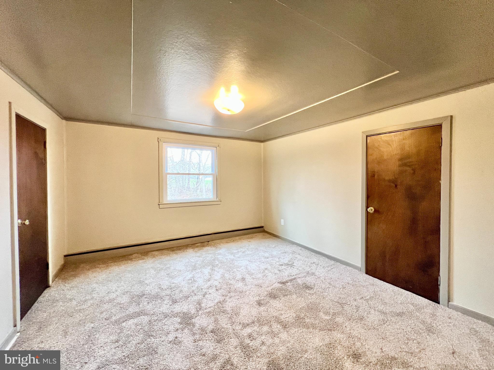 1722 Saxton Road Saxton, PA 16678 - Photo 14 of 24 an empty room with windows