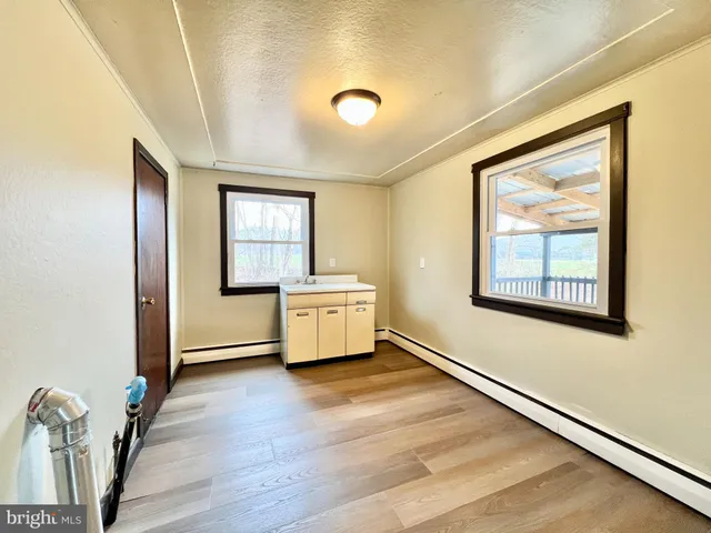 a view of a livingroom with wooden floor