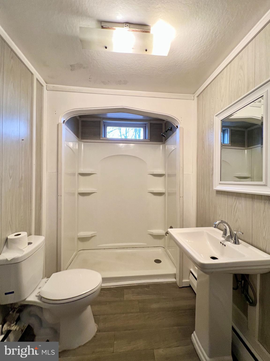 1722 Saxton Road Saxton, PA 16678 - Photo 19 of 24 a bathroom with a sink toilet and shower