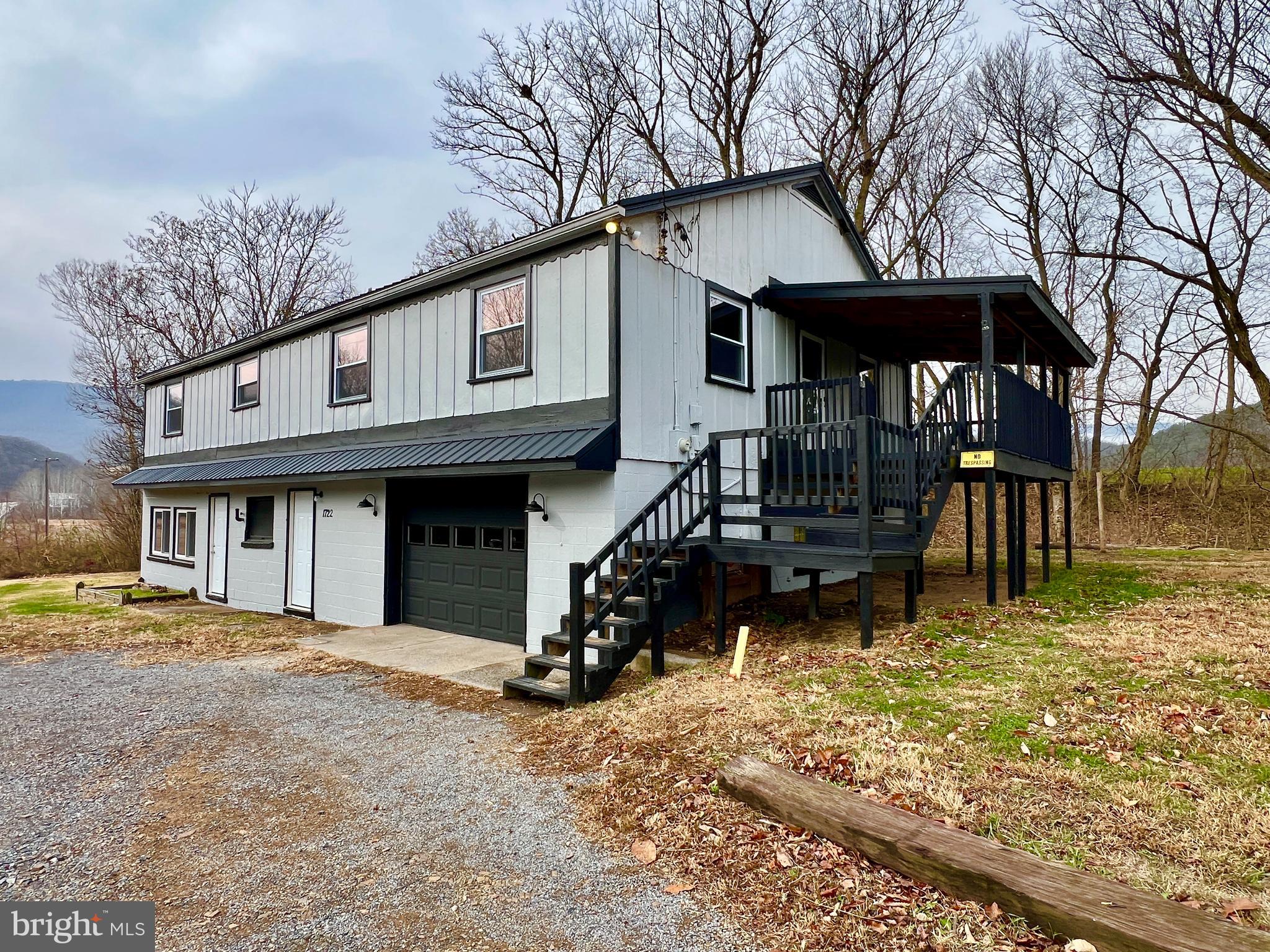 1722 Saxton Road Saxton, PA 16678 - Photo 2 of 24 a front view of a house with a yard