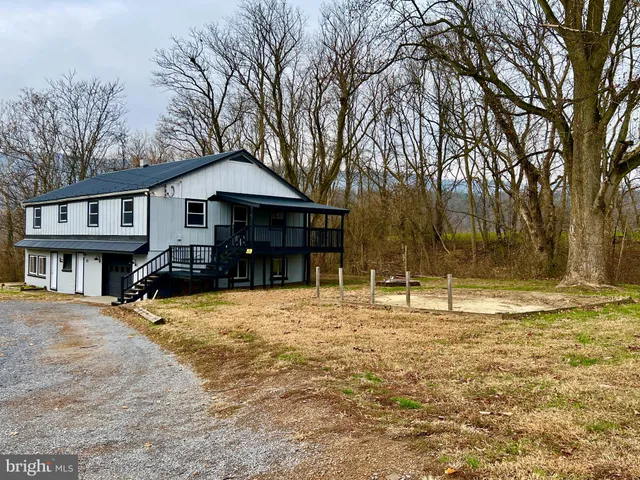 a house with trees in front of it