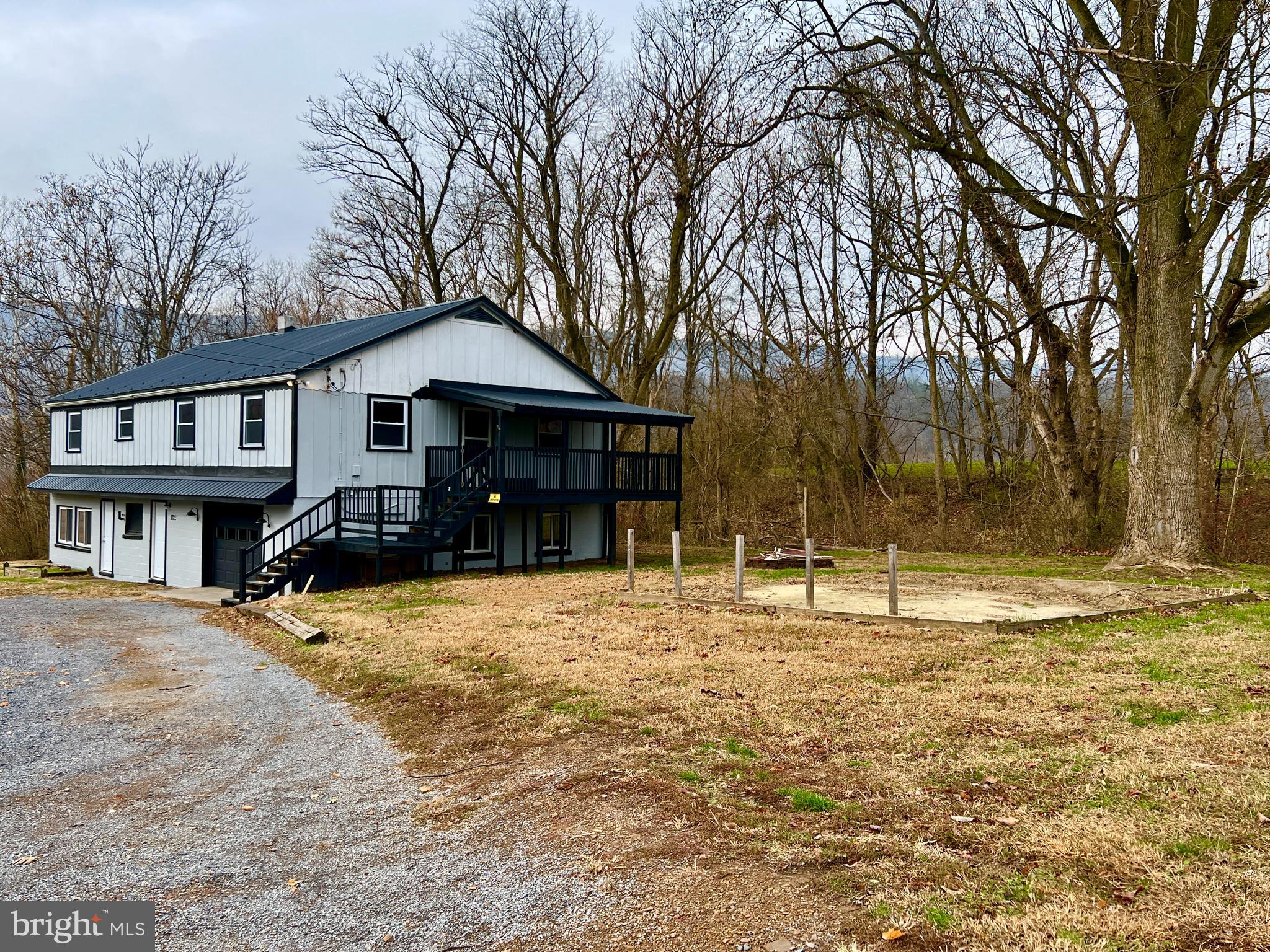 1722 Saxton Road Saxton, PA 16678 - Photo 3 of 24 a house with trees in front of it