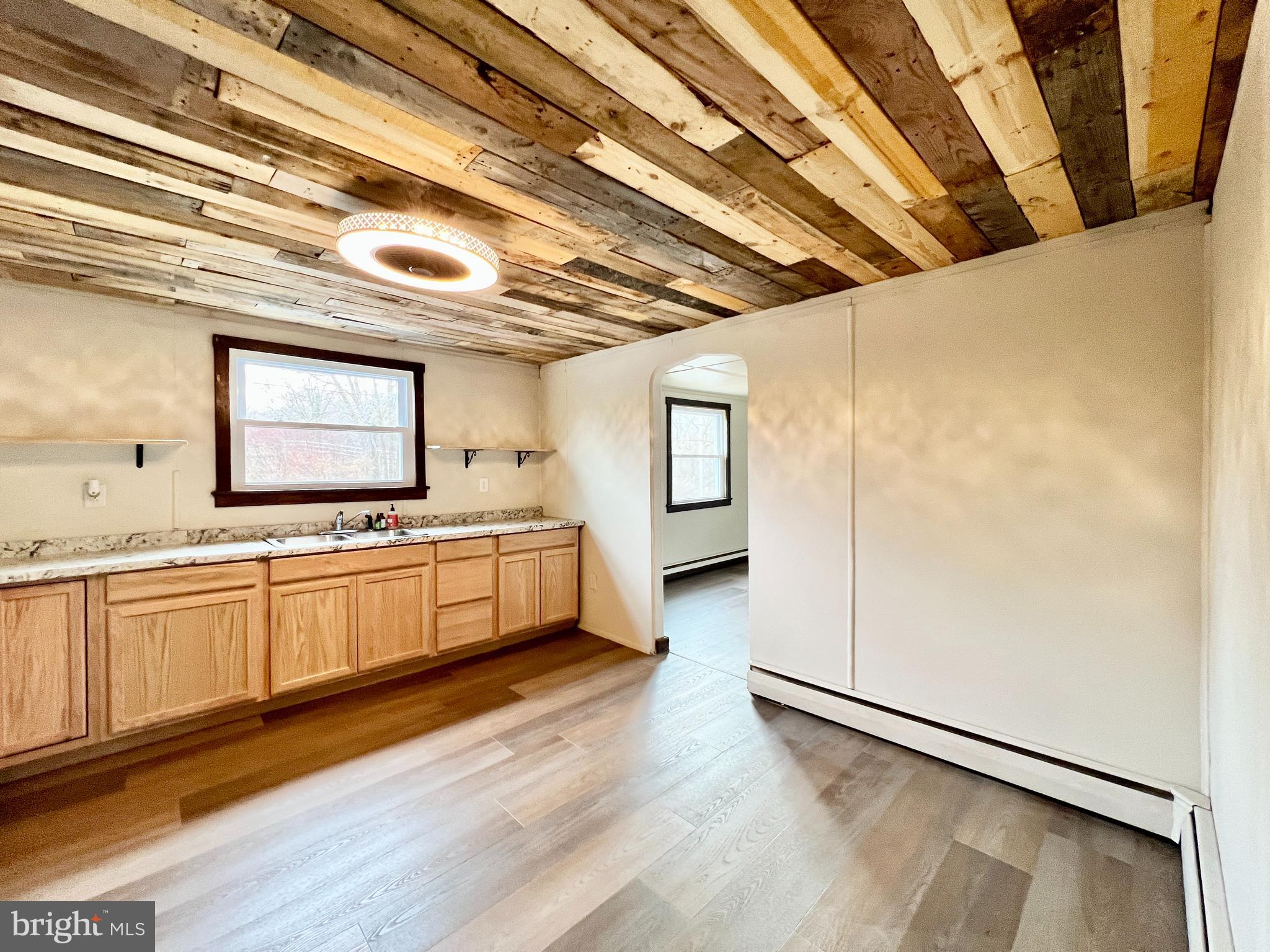 1722 Saxton Road Saxton, PA 16678 - Photo 10 of 24 a large white kitchen with a large window