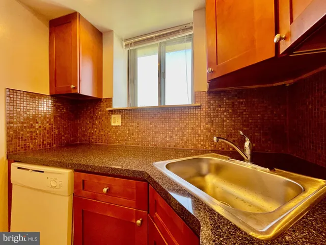 a bathroom with a tub and a sink