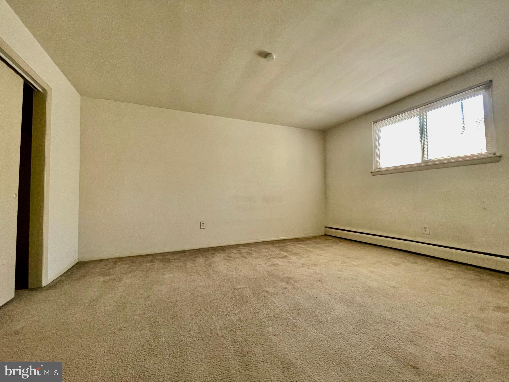 141 East 4th Avenue, Unit A1 Conshohocken, PA 19428 - Photo 9 of 10 a view of an empty room with a window
