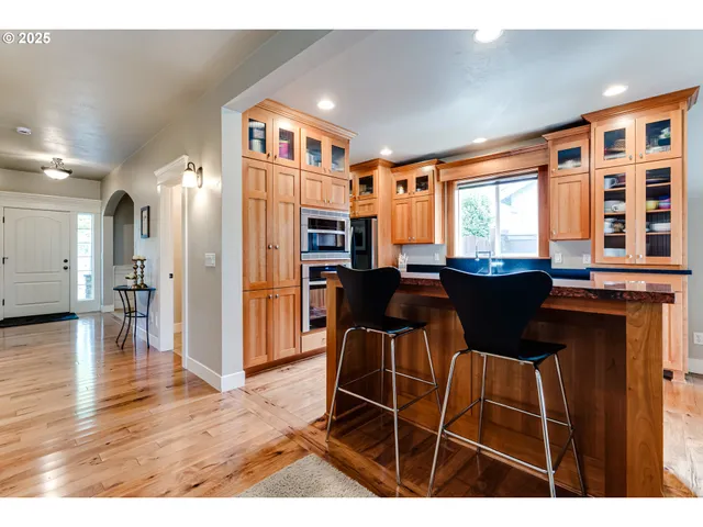 a view of a dining room with furniture and a window