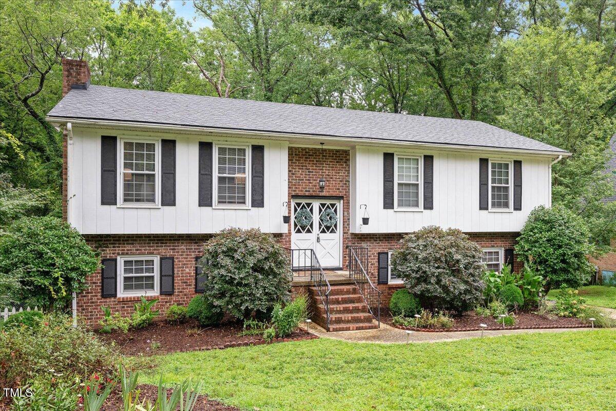 5812 Old Forge Circle Raleigh, NC 27609 - Photo 2 of 31 a front view of a house with a yard