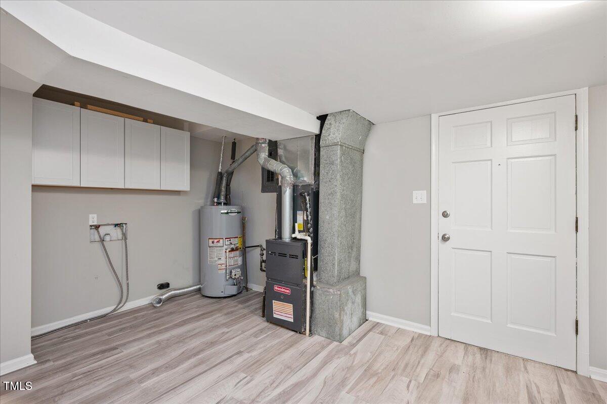 5812 Old Forge Circle Raleigh, NC 27609 - Photo 22 of 31 a view of empty room with wooden floor and ceiling fan