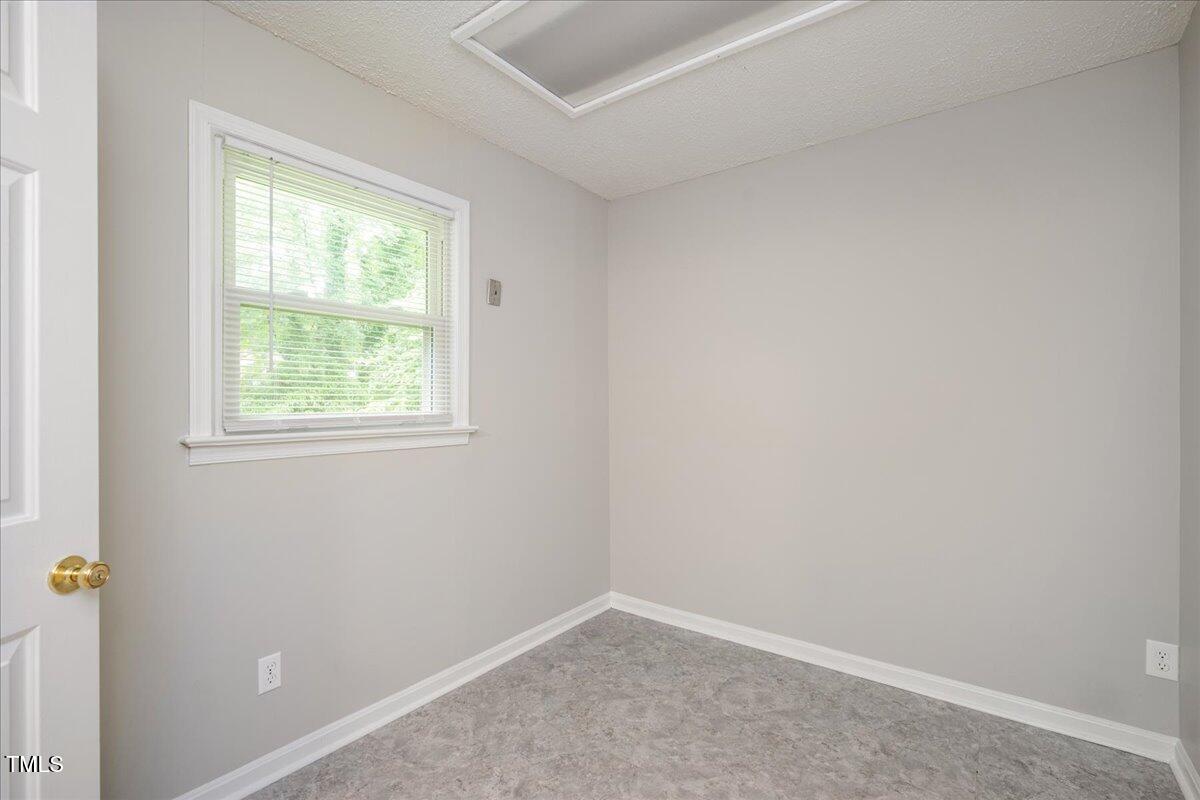 5812 Old Forge Circle Raleigh, NC 27609 - Photo 23 of 31 an empty room with a window