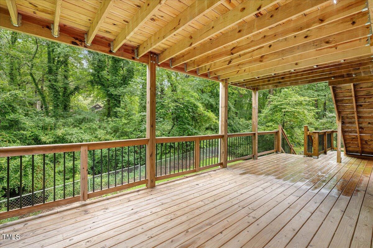 5812 Old Forge Circle Raleigh, NC 27609 - Photo 26 of 31 a view of balcony with wooden floor and fence